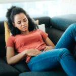 Black Woman With Period And Menstrual Pain