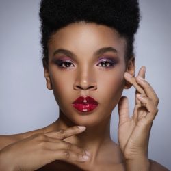 Portrait of Young African model with a beautiful makeup in studio